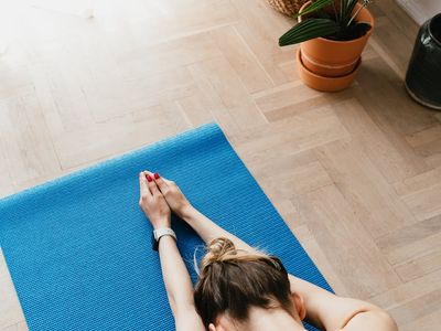 A neatly rolled yoga mat in a quiet room.
