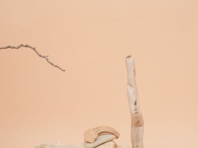 A stack of balanced stones against a serene background.