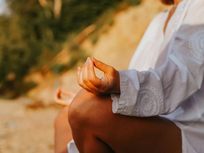 Close-up of hands in a graceful yoga mudra.